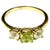 Charming 14K Gold, Peridot and Cubic Zirconia Cocktail Ring. Ring features a vivid green peridot flanked by two colorless...