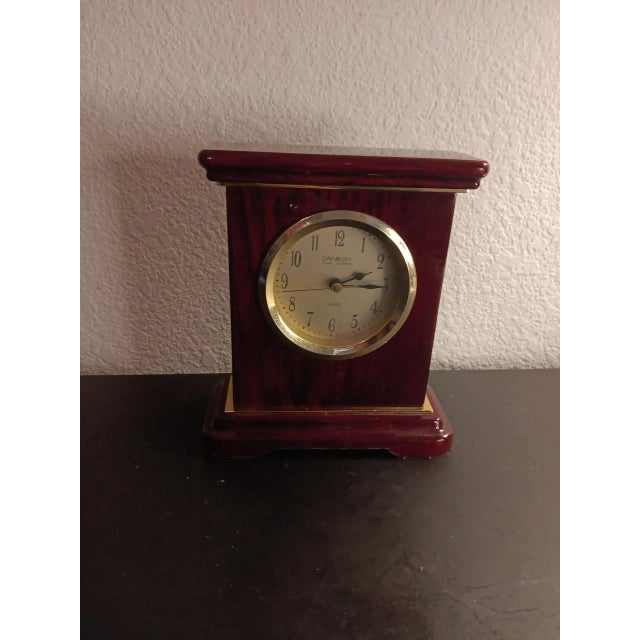 GORGEOUS Danbury 6" Burlwood Mahogany Finish Mantle or Desk Clock. This stunning Danbury timepiece boasts a rich mahogany...