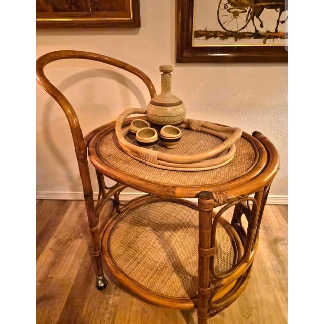This is a gorgeous Mid-Century Bar Cart in the Style of McGuire. The top woven wicker could be refinished or covered...