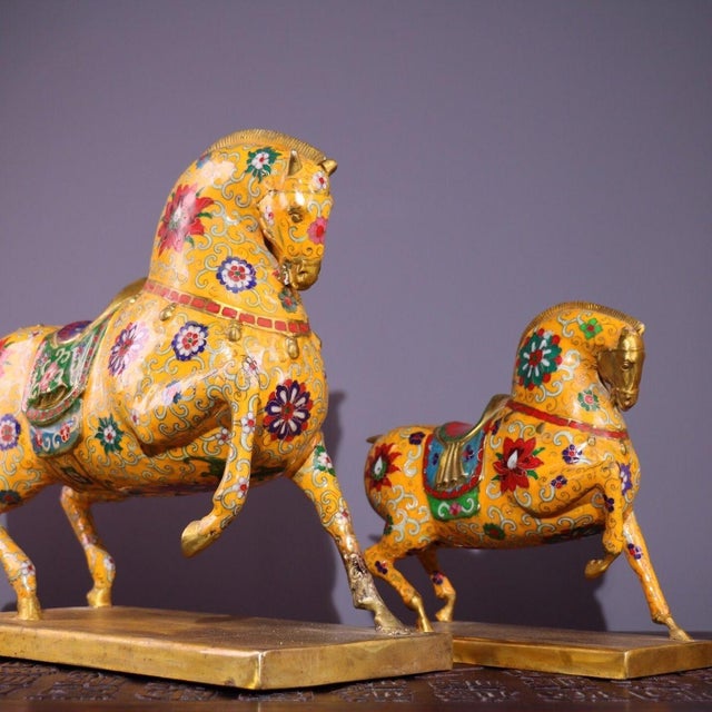 This charming pair of horse figures—one large and one small—is crafted from a bronze body and richly decorated with...
