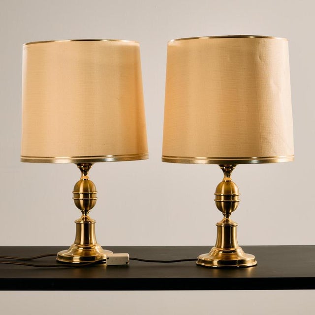 A truly classic and elegant piece. A pair of brass table lamps with rounded shapes from the 1970s, produced by Otterpohl...