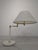 Hollywood Regency Brass Table Lamp Stylish Hollywood Regency brass table lamp. The lampshade resembles white marble. The...