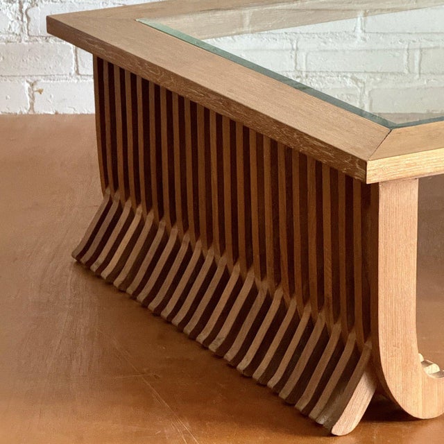 A mid century coffee table with unique fluted design originated from Thailand dating back to the 1980s. Made of cerused...