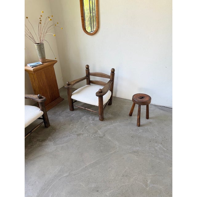 Antique tripod stool, also known as a shepherd's stool, in solid oak. We love its overall look, its slightly flared tripod...