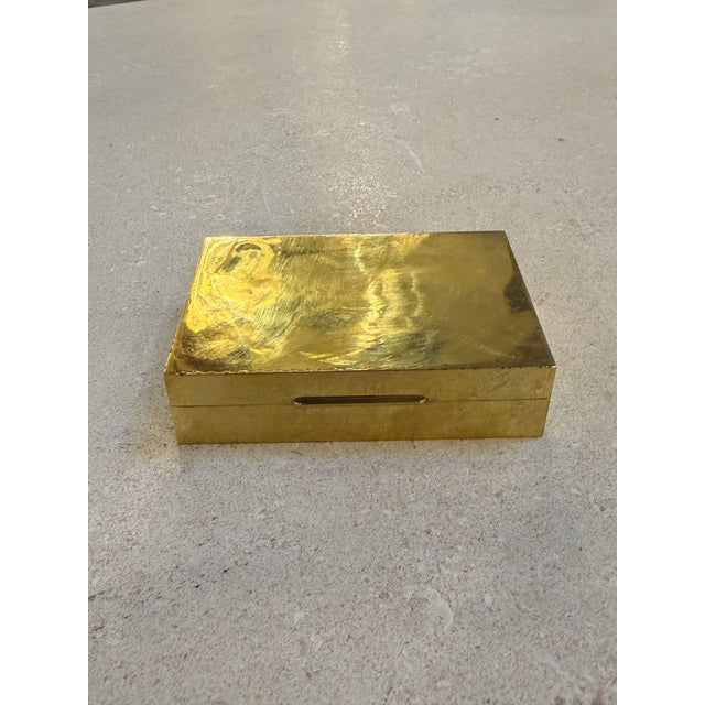 Minimalist Italian brass box from the mid-century period, distinguished by its hand-hammered surface and clean geometric...