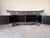 A stunning Baker Furniture sideboard inspired by classic Ming-style design, featuring an elegant black crackle finish...