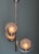 This Art Deco chandelier is chrome-plated and features three glass globes with Art Deco ornaments, offset in height. A...