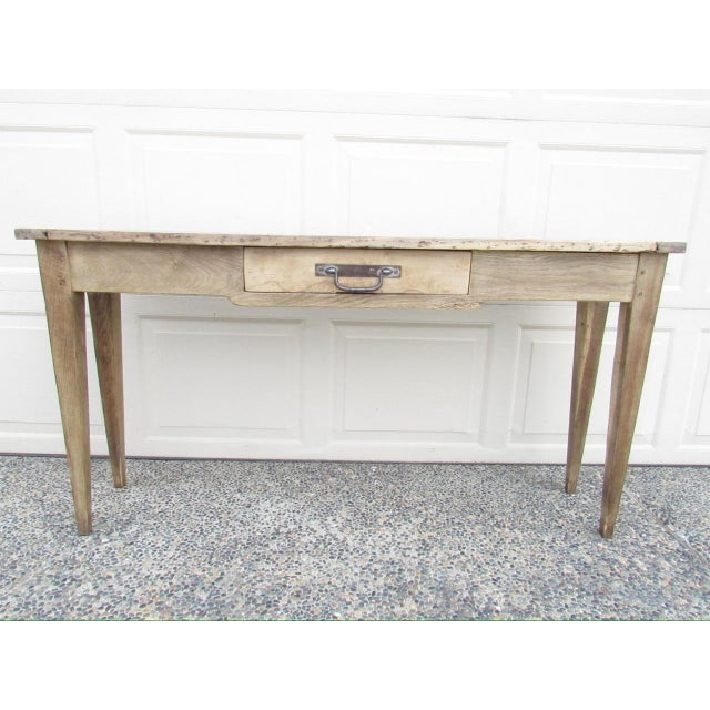 Antique French bleached oak rustic console table, c.1850 A long and narrow, only 13” deep, console table that has a...