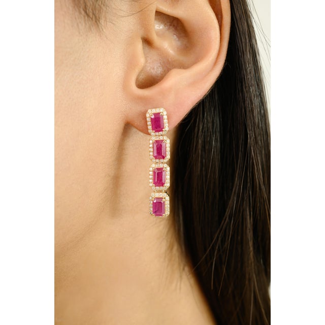 Radiating timeless elegance, these Elegant 14k Yellow Gold Emerald-Cut Ruby and Diamond Halo Long Drop Earrings are a true...