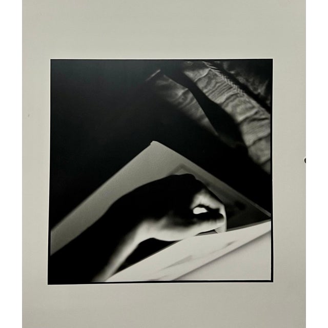 Bruce Cratsley, American (1944-1998) Vintage gelatin silver print Lifting Hand (Scot) Chez Moi A surrealist image of a...