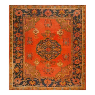 Decorative Turkish Antique Oushak Rug on a Red-Raspberry Background Color With Medallion Pattern For Sale