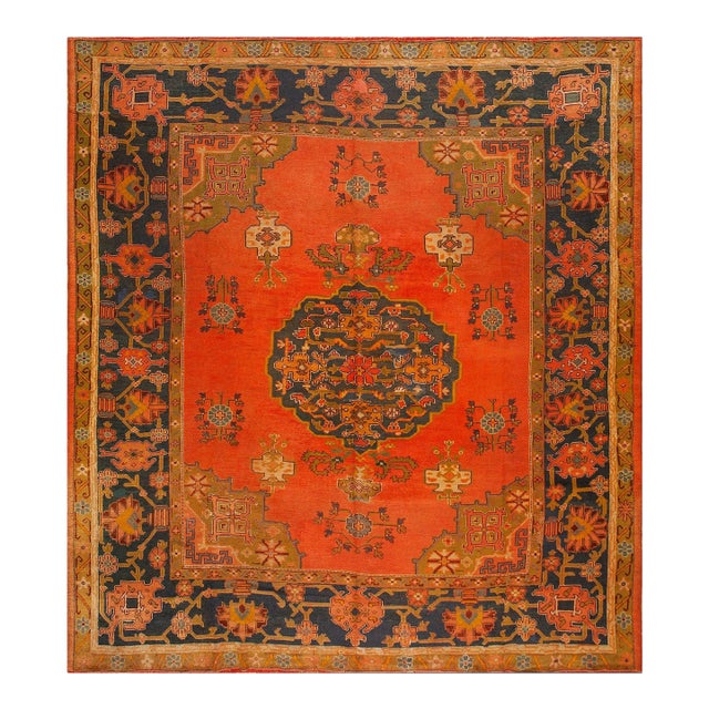 Decorative Turkish Antique Oushak Rug on a Red-Raspberry Background Color With Medallion Pattern For Sale