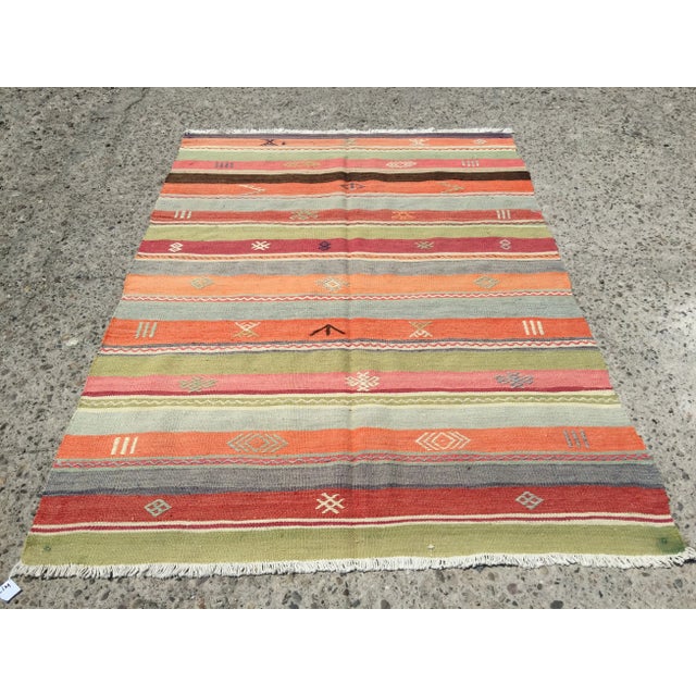 A 50 year old vintage Kilim rug that's more hip now than ever before. It's very high quality, made with vibrant natural...
