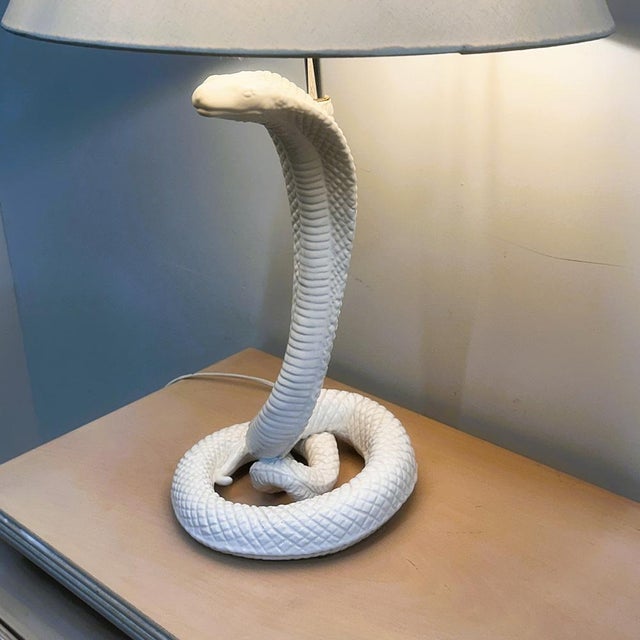 A spectacular 1970s ceramic cobra lamp attributed to tommaso barbi, known for his glamorous sculptural designs and bold...