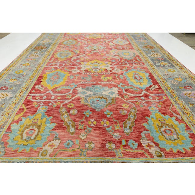 Strikingly oversized 12x25 modern Turkish Oushak rug, hand-knotted in lustrous wool with a vivid red field and intricate...
