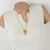 This stunning Christian Lacroix Paris pendant necklace features a stylized knitting lace design with gilded metal, all...