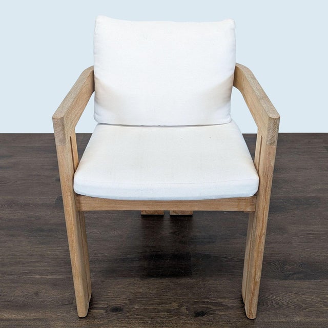 This Restoration Hardware chair features a sturdy weathered teak frame and comfortable white cushions. The simple, modern...