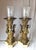 A pair of gilt bronze figural neoclassical lamps with marble bases. The bronzes with gilt surface showing wear but...