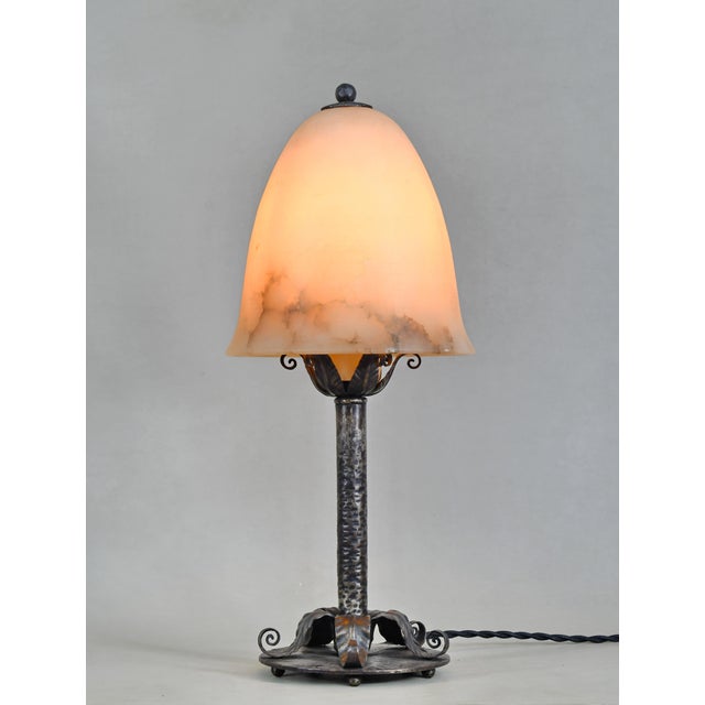 Edgar Brandt A rare French art deco lamp made around 1925 by Edgar Brandt in wrought iron of superb quality. It holds its...