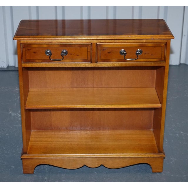 This elegant vintage dwarf bookcase is crafted in beautifully figured burr yew wood, showcasing rich grain patterns and...