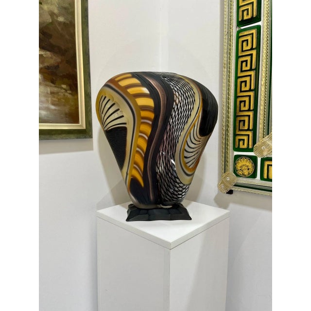 This one-of-a-kind Murano Glass Vase is part of the "Carnevale" Series by the Schiavon Art Team. It features lovely colors...