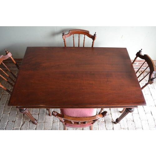 19th-century Dutch mahogany dining table with four chairs. The height of the table is 76 cm. The length of the table is...