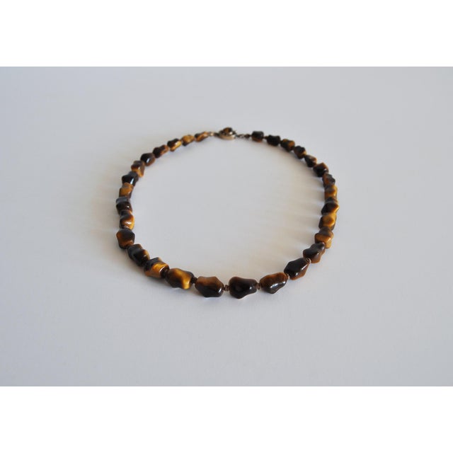 Beautiful vintage necklace with genuine tiger's eye and sterling silver. Designed by erik poul fenster, 1960s. Stamped epf...