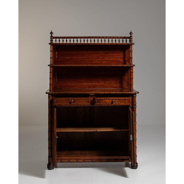 Carved walnut server with gallery shelf in Rich Walnut Brown. The rich walnut brown surface highlights turned finials,...