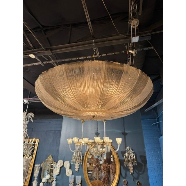 The Large Murano Glass 2-Tone Disc Flush Mount Chandelier is a stunning ceiling fixture that adds a touch of elegance to...
