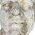 An evocative hollow-cast plaster portrait head of a man, modeled with strong, expressive features and an unusual upward-...