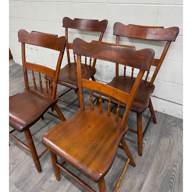 This is a gorgeous set of four antique American Country Farmhouse plank seat dining chairs, likely from 1880–1910....