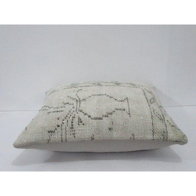 Decorative pillow cover made from a vintage Turkish handknotted rug. Backed with good quality cotton fabric. Pillow...