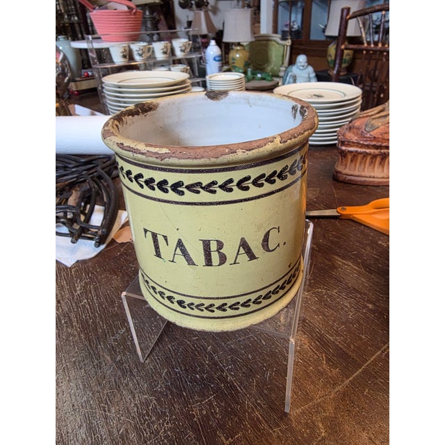 Charming antique French Tobacco jar with tin glazed yellow finish and aged surfaces.