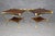 An exceptional and highly decorative pair of Regency-style mahogany and brass-mounted two-tier side tables, dating to...