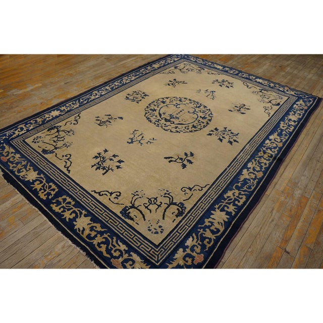 Antique Chinese Knotted Rug, Circa Date: 1900s. This exquisite example of early 20th-century weaving presents a striking...