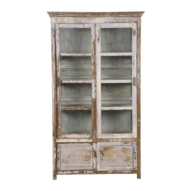 Large showcase with sliding wooden doors (old teak) patinated. This piece is designed in the style of the selected...