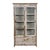 Large showcase with sliding wooden doors (old teak) patinated. This piece is designed in the style of the selected...
