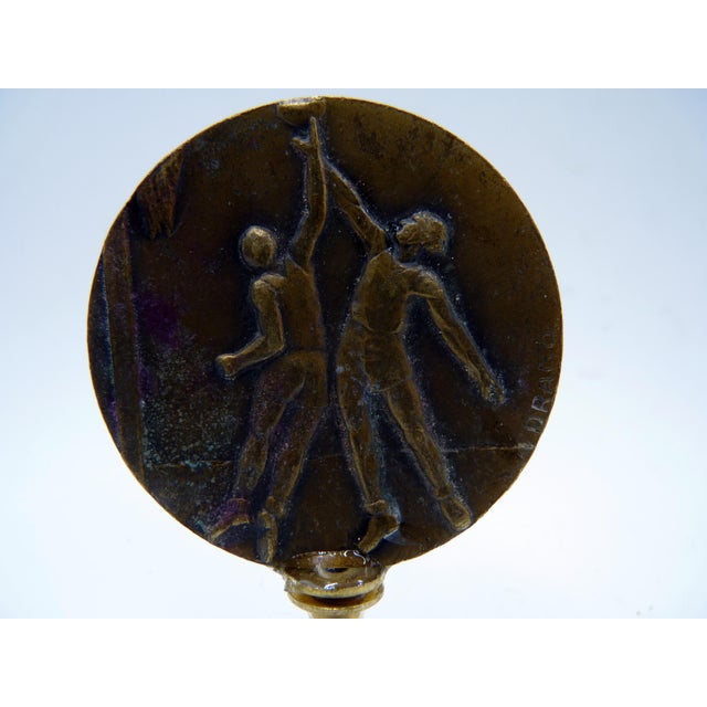Vintage French bronze commemorative basketball medal depicting two athletes in dynamic relief, signed "Dirago" and dated...
