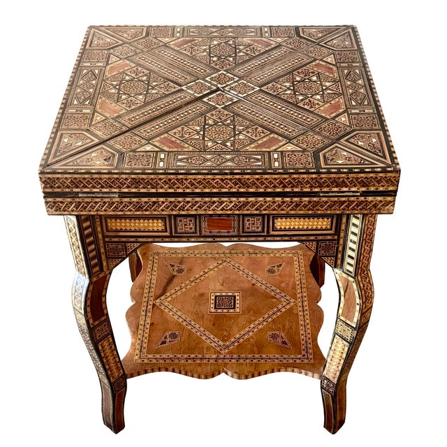 A beautiful example of traditional Middle Eastern craftsmanship, this vintage square folding game table features intricate...