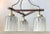 This mid-century Modern 3-shaded chandelier was manufactured in Denmark during the late 1950s in a style inspired by...