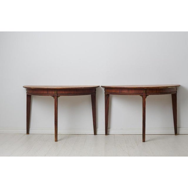Genuine Swedish demi lune table from the gustavian period. The table consists of two free-standing halves and can be used...