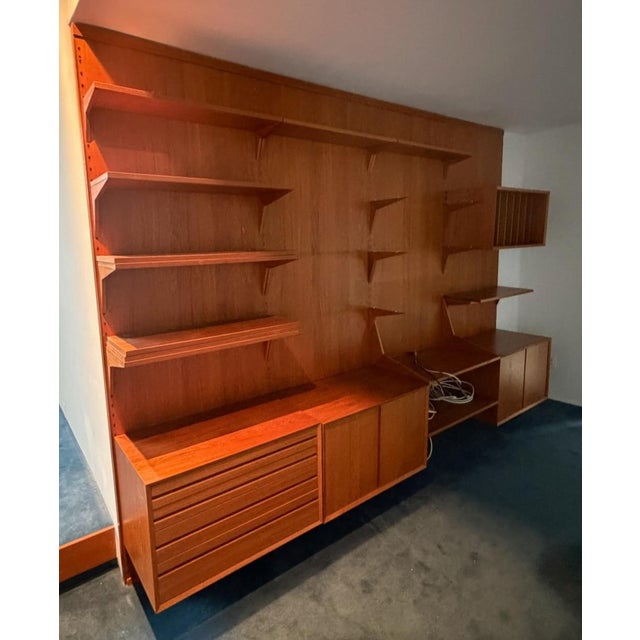 ​A rare 4-bay Cado Royal System wall unit, designed by master architect Poul Cadovius and manufactured in Denmark. This...