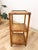 This charming vintage woven rattan end table that can double as a shelf with glass top is a warm and practical coastal and...
