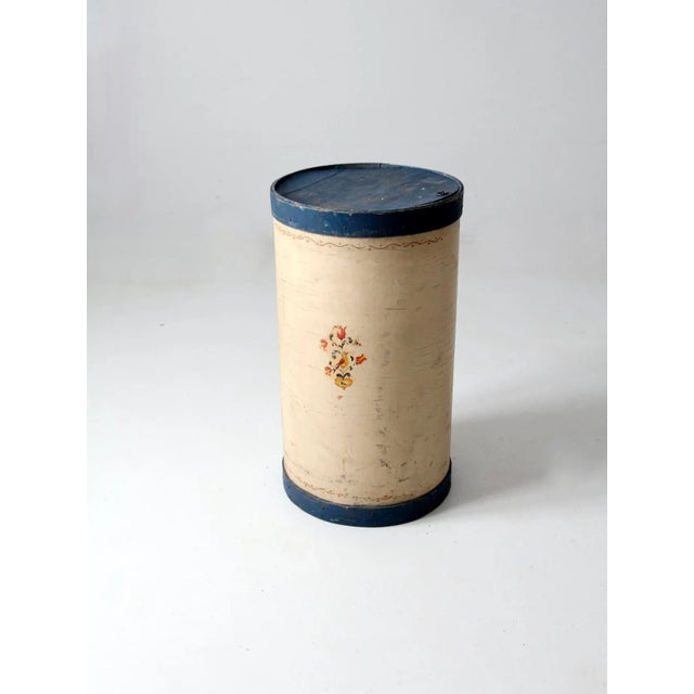 Rare antique tall wooden pantry box with an elongated band box form. This charming piece features a soft cream painted...