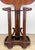 A beautiful and highly decorative hall tree with filigree shapes and curves emblematic of Empire style, circa early...