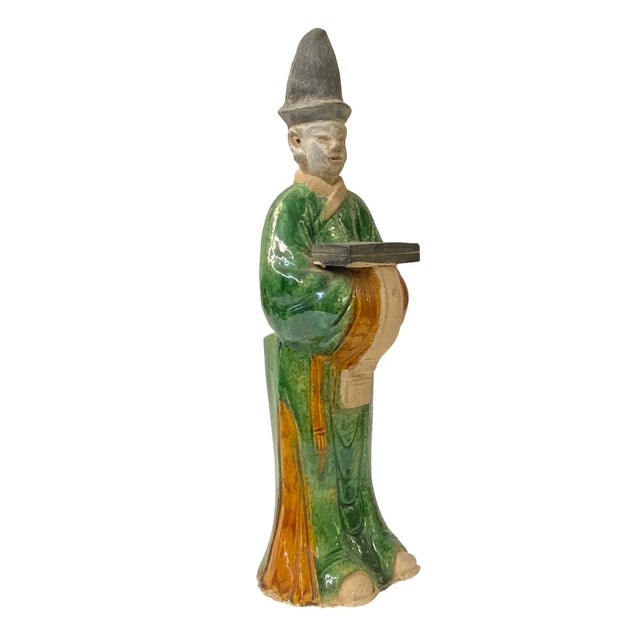 This is a handmade oriental ancient dressing figure display piece in a yellow-white green glaze finish. Dimensions: 4.75"x...