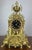 This elegant Vintage French brass mantel clock set is a richly decorative ensemble, comprising an ornate central clock...