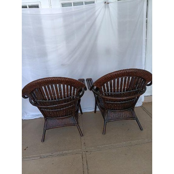 Dark brown wicker rattan armchairs high rounded backs and open side cutouts set of 2 Style: Coastal Color: Brown...
