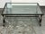 Design Plus Gallery presents the Alpine Lodge Collection Glass Coffee Table by Ralph Lauren Home. A rectangular glass top...