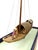 A miniature stone sailboat with people sitting inside. This is a vintage piece from the 1960’s and can be removed from the...